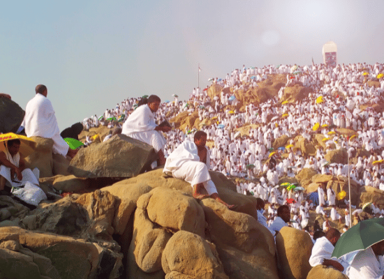 Pilgrims standing on Mount Arafat