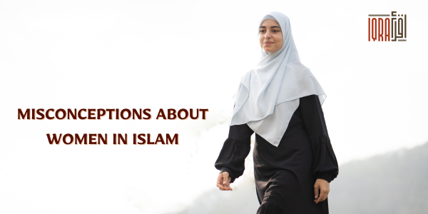 A diverse group of Muslim women in hijabs, smiling and holding books, standing together in a bright, welcoming environment.